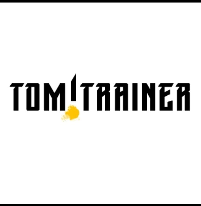 TOM TRAINER